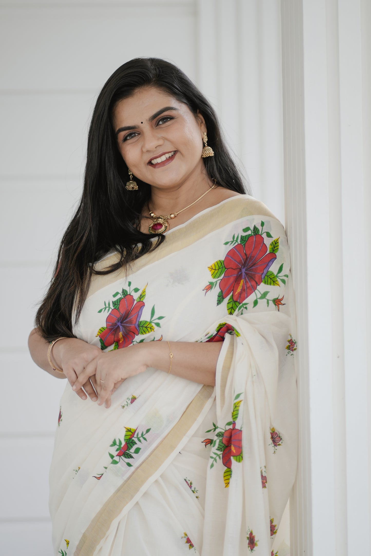 Kerala Kasavu Saree with Red Floral Print