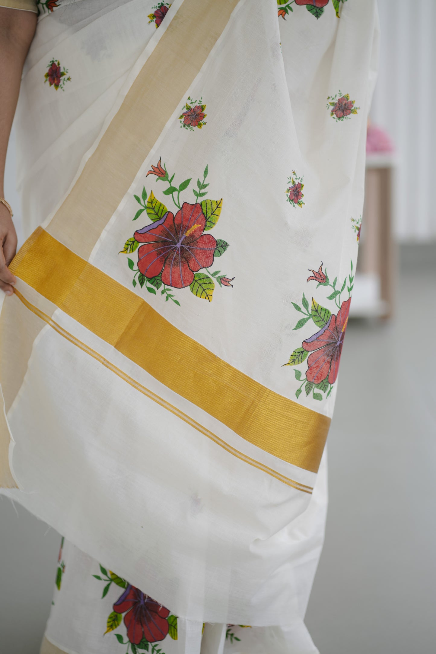 Kerala Kasavu Saree with Red Floral Print