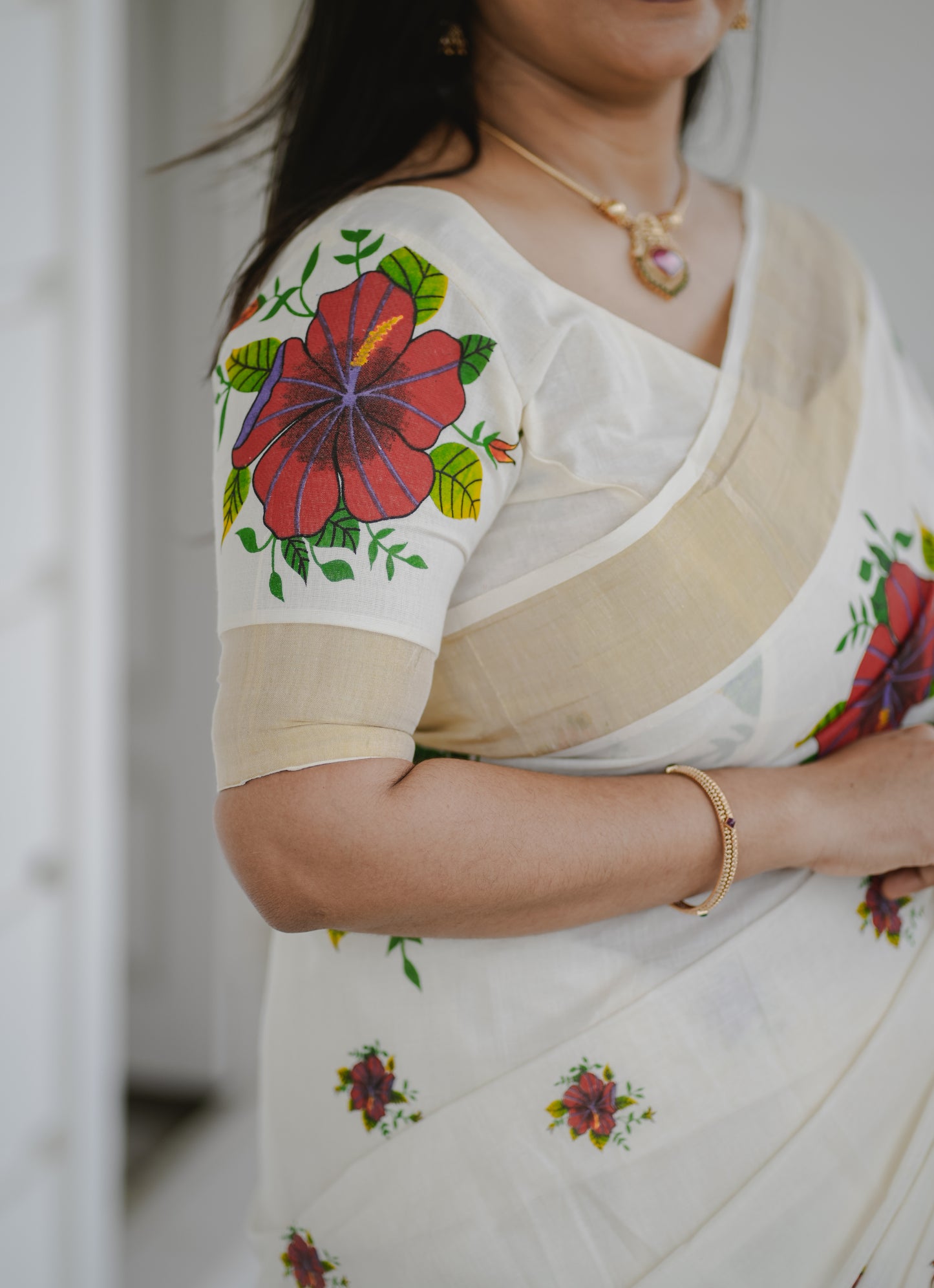 Kerala Kasavu Saree with Red Floral Print